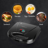 Aigostar Sandwichera con superficie antiadherente de rejilla profunda para huevo, jamón, filetes parrilla eléctrica compacta Tostadora de Pan Negro, certificado ETL, Roy